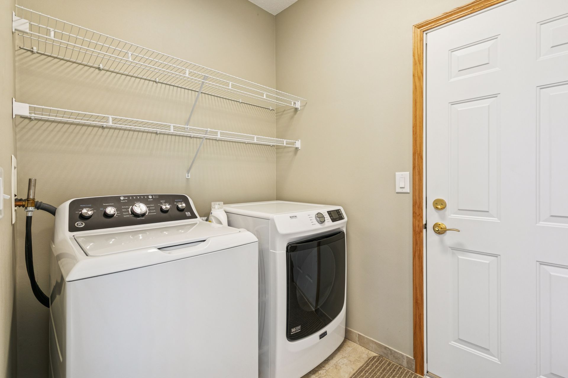 Laundry room with newer washer dryer
